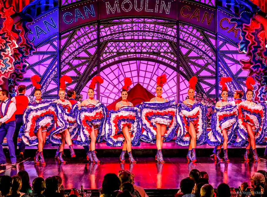 Cancan dancer in a mid-air split with a blue ruffled skirt and a partner, Moulin Rouge dinner show tickets