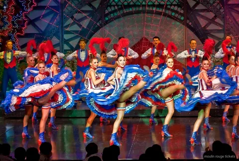 Moulin Rouge show tickets with champagne service at a cabaret table in Paris